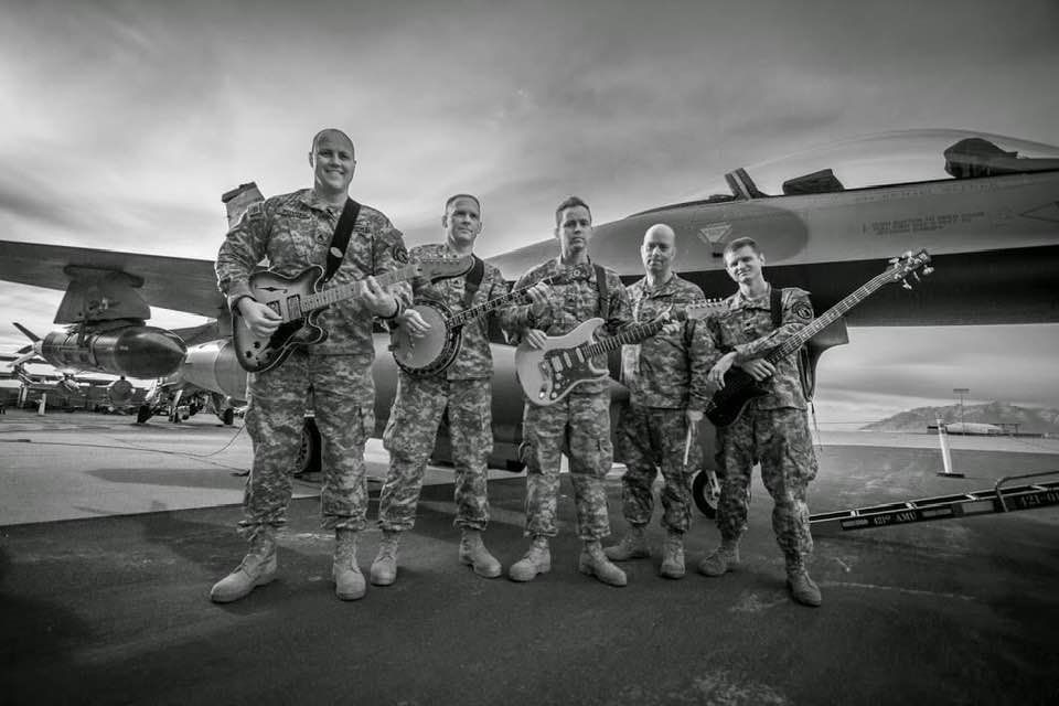 Enlisted in the Army and joined the 23rd Army Band as an Army musician